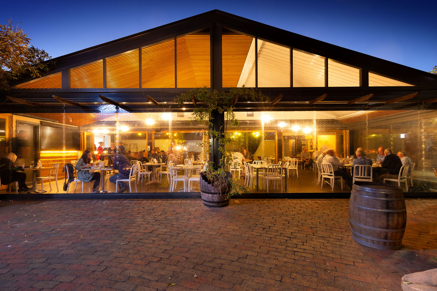 Courtyard area with people dining at dusk